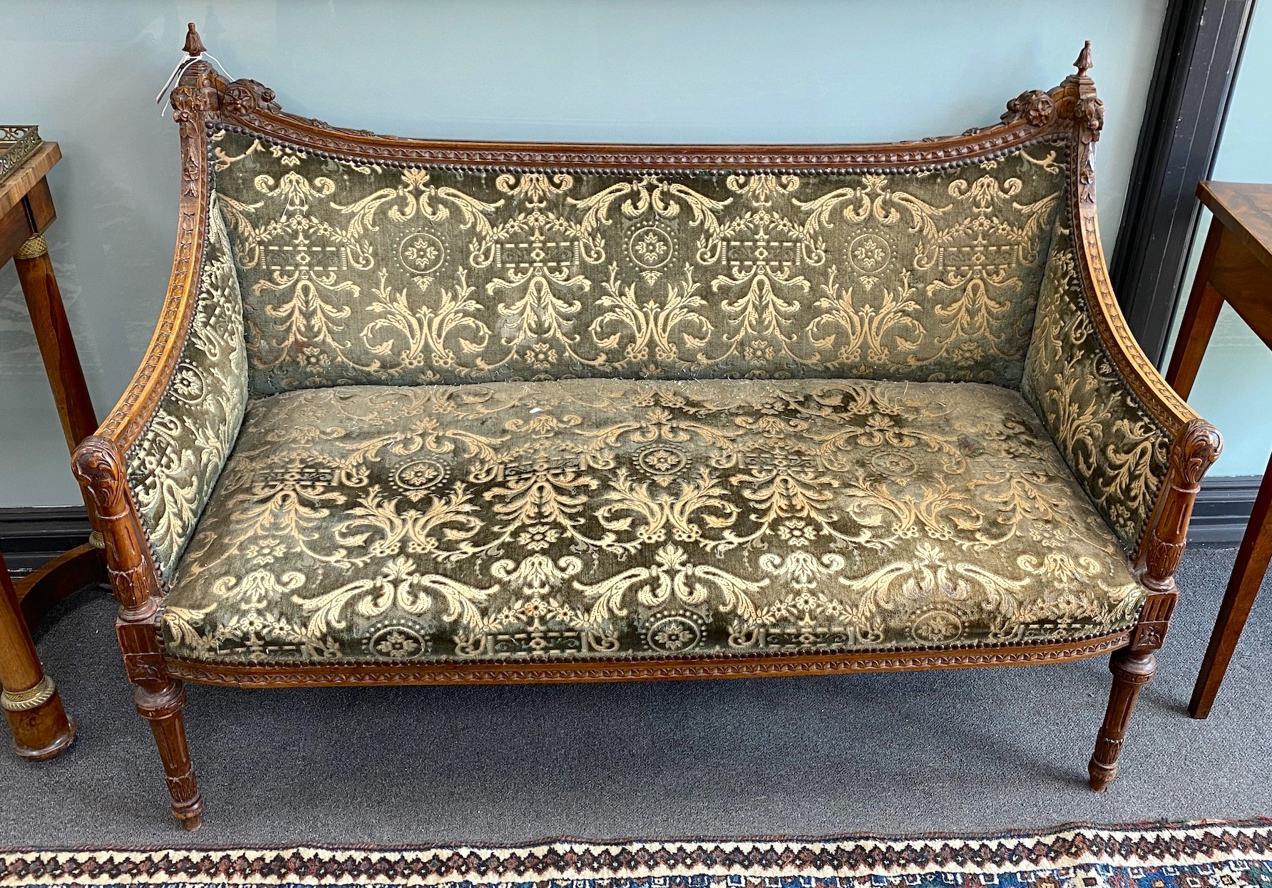 A continental carved walnut settee, length 128cm, depth 54cm, height 90cm